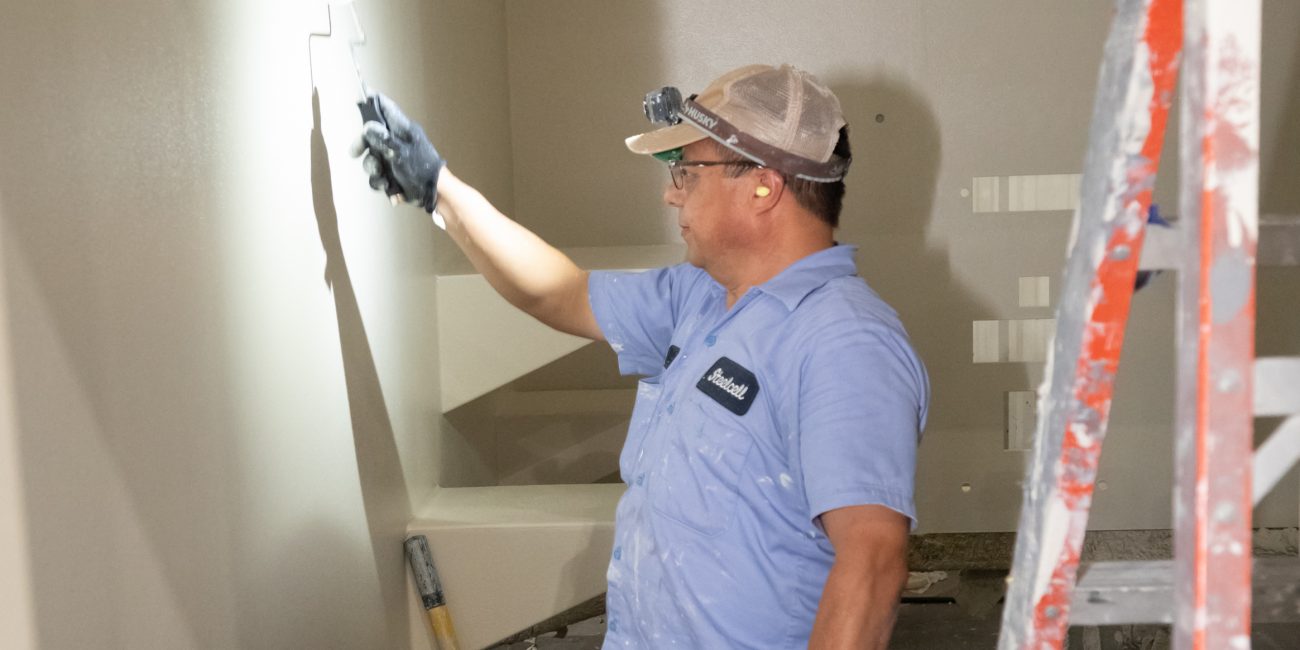 Person installing detention center hardware