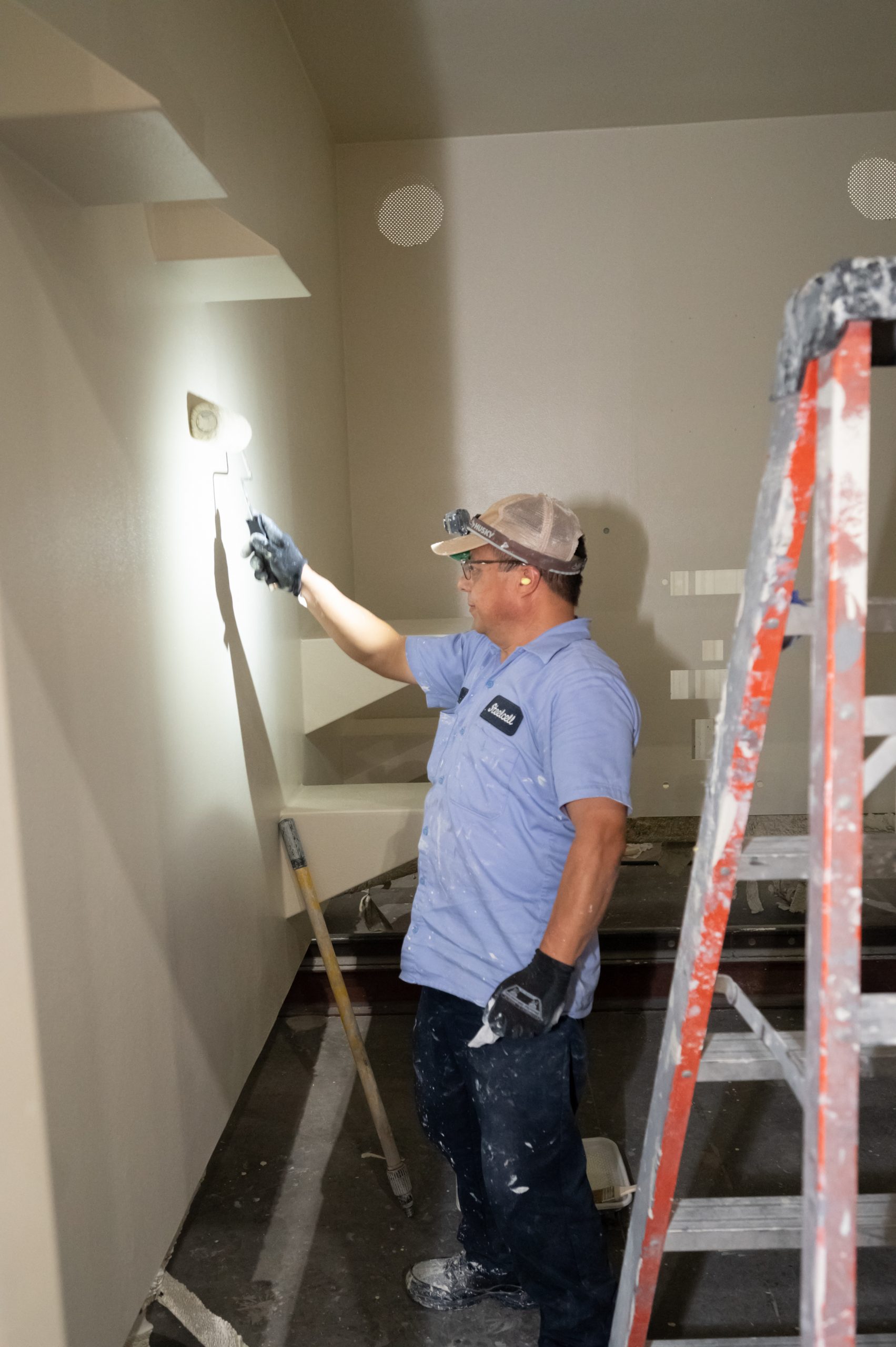 Person installing detention center hardware