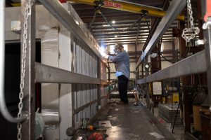 SteelCell employee working on jail hardware