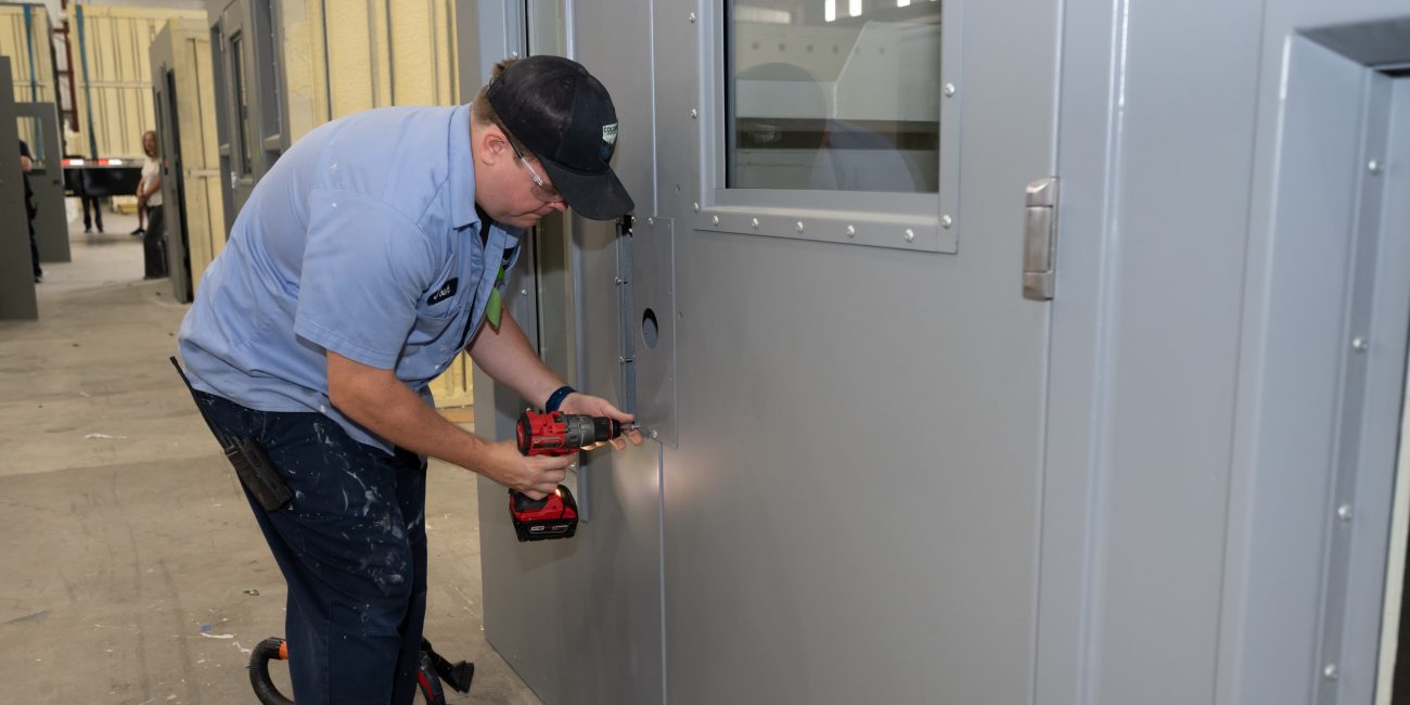 Installing jail cell lock hardware